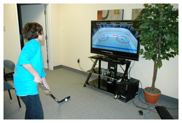 Jacob Burke, age 12, improves his stickhandling skills with his head up, on the new QuickStickz product