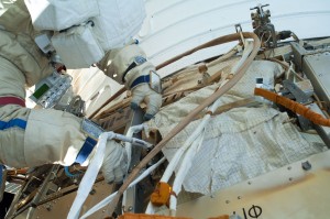 A cosmonaut working with connectors during spacewalk #35, on August 22, 2013 